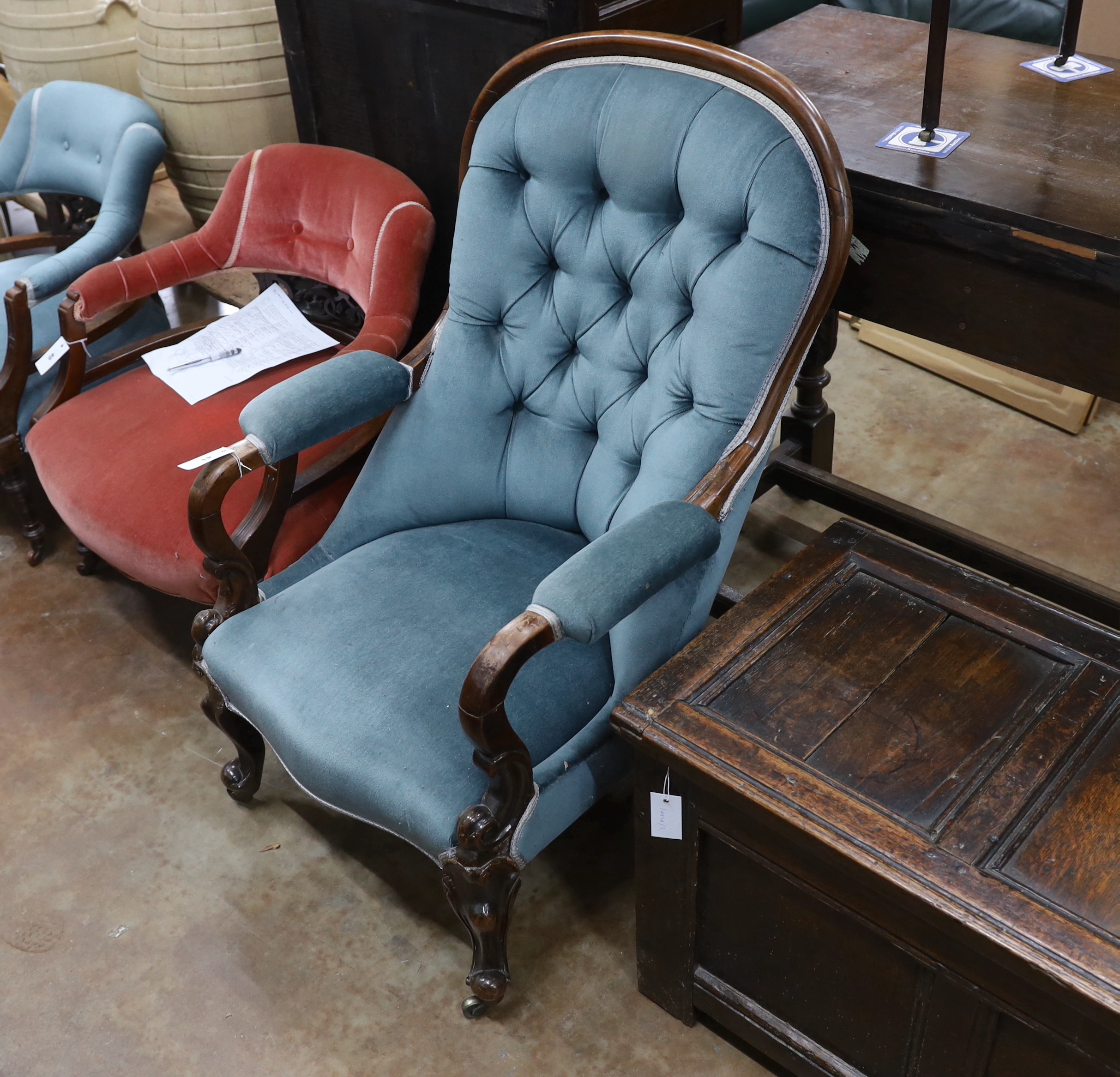 A late Victorian mahogany framed button back armchair, on cabriole legs, width 68cm, depth 72cm, height 102cm